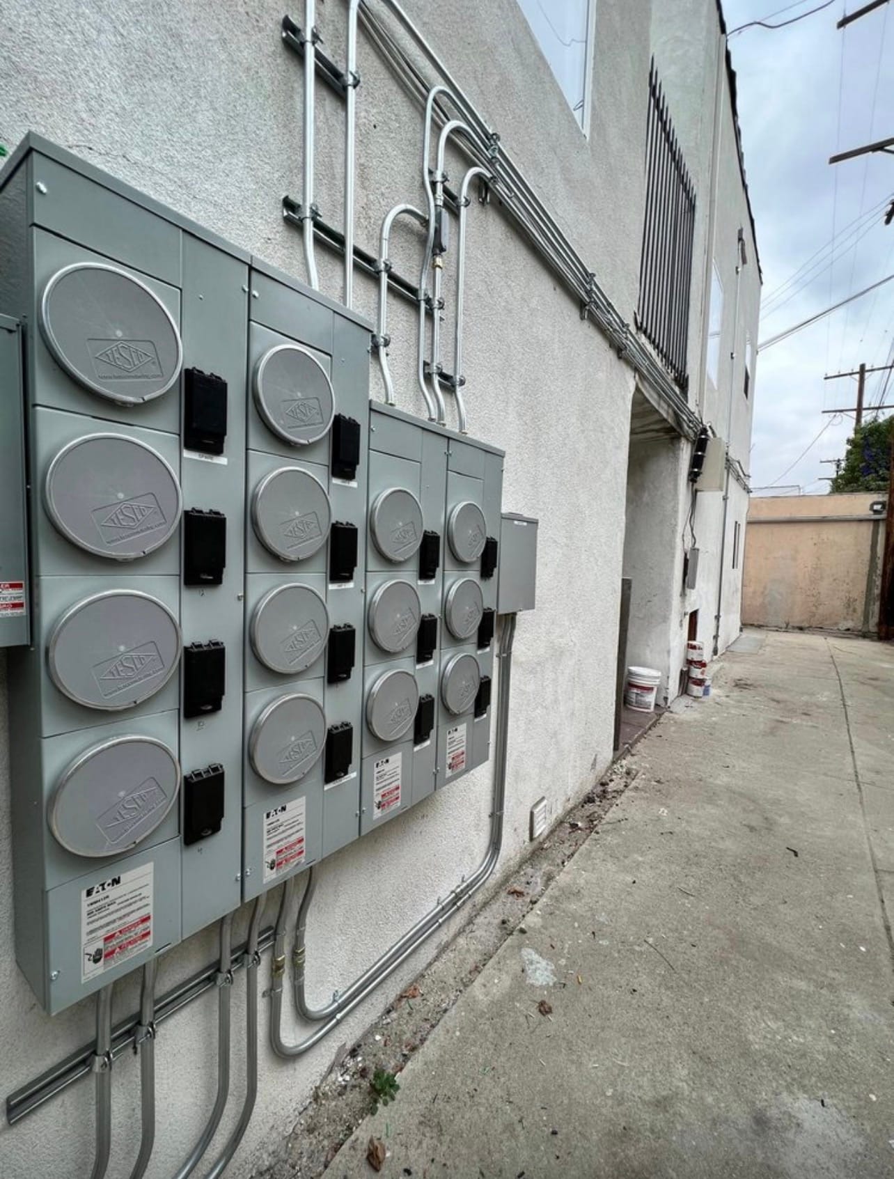 Multi-unit meter bank installed on an exterior wall