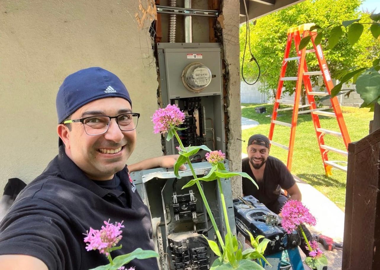 Two AQE technicians during a panel installation