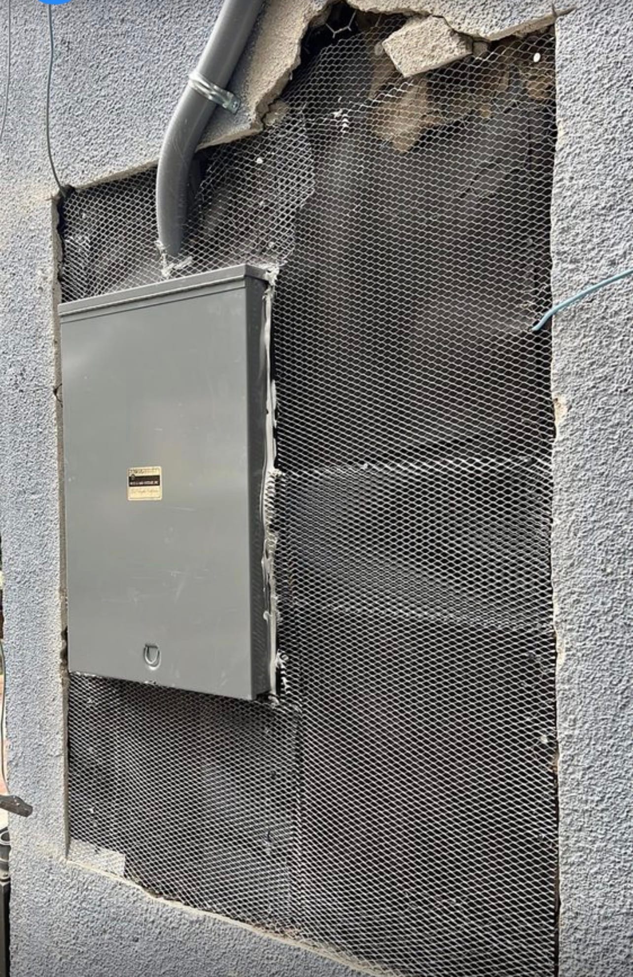 New meter panel opening prepped for a stucco patch