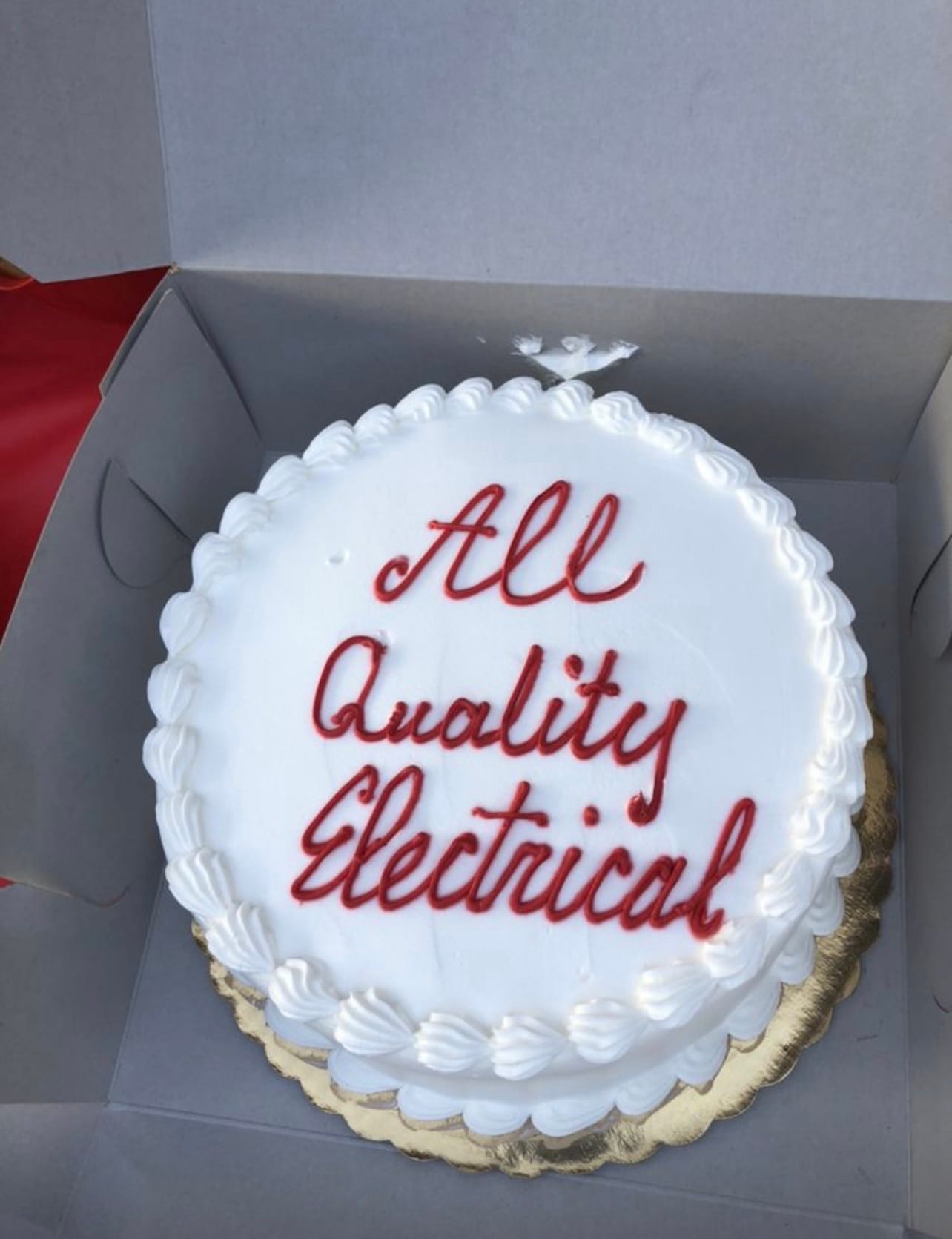 A cake reading All Quality Electrical